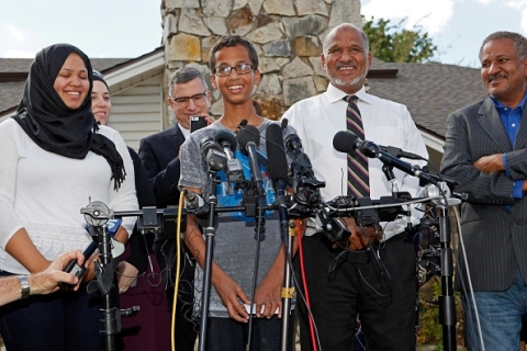 Ahmed Mohamed talking to reporters as his family expressed their appreciation by offering a pizza treat to reporters outside their Irving, Texas home. Photo: Getty Images